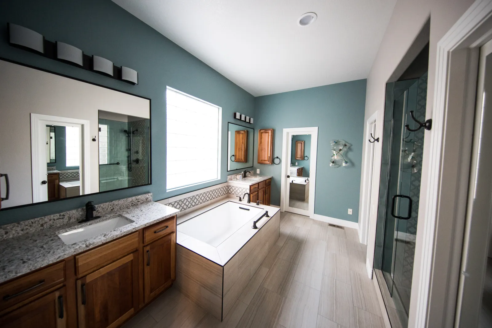 Modern bathroom remodel with walk-in shower by EZ Renovations in Waldorf MD