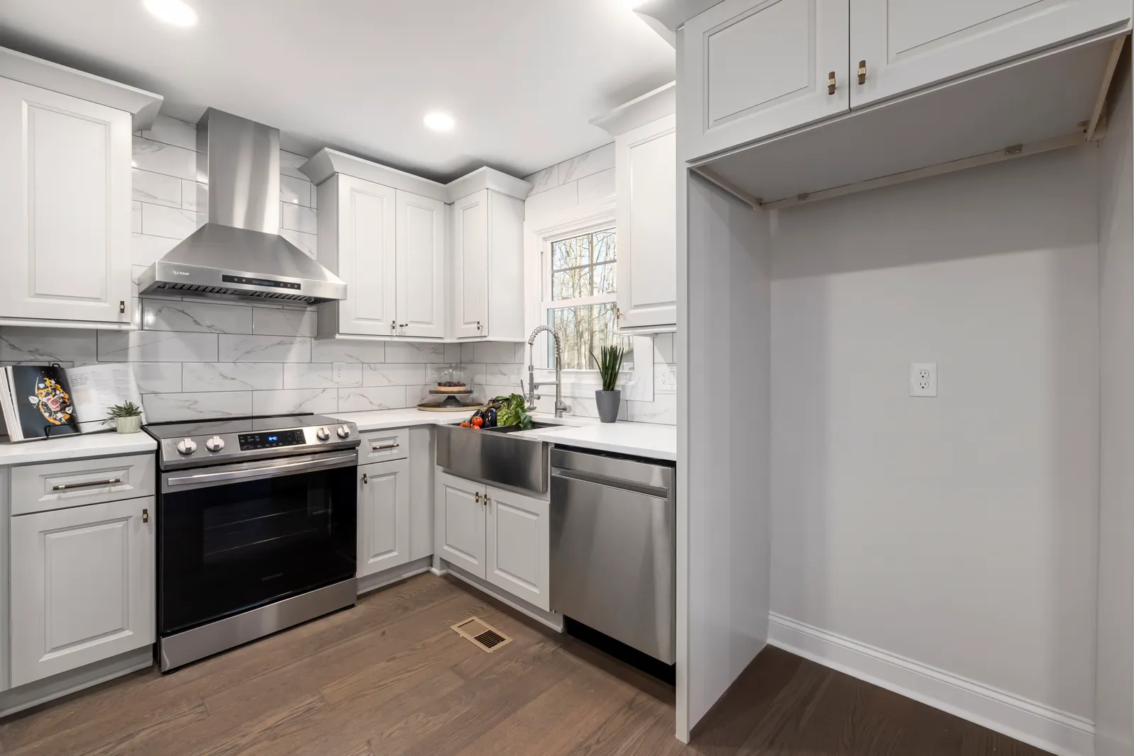 Kitchen renovation with custom cabinetry and island by EZ Renovations